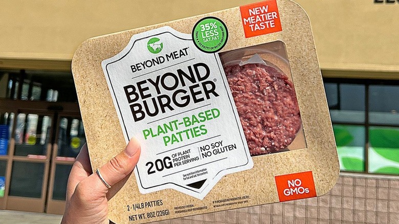 Woman holding Beyond Burger package