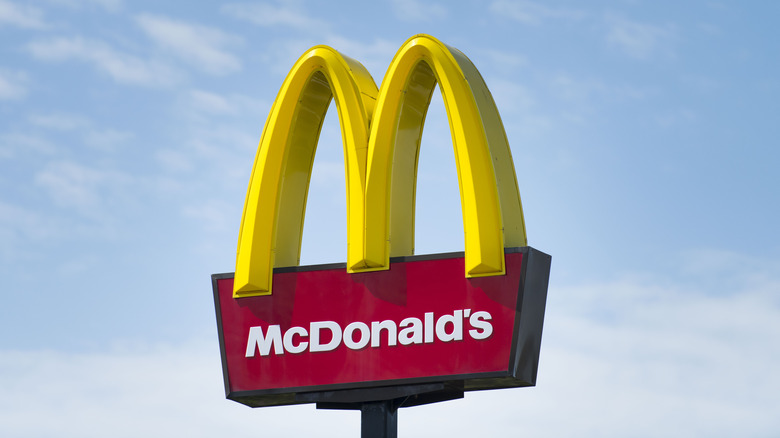 McDonald's golden arches against a blue sky