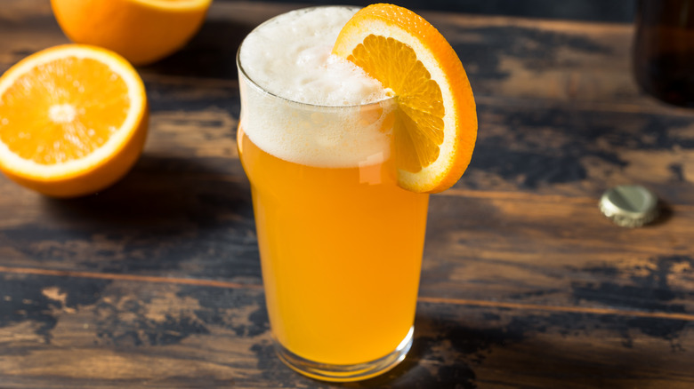 Beer with orange garnish
