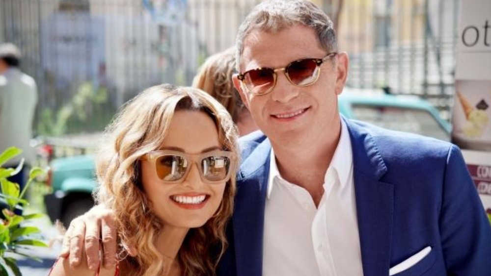 Bobby and Giada smiling, wearing sunglasses