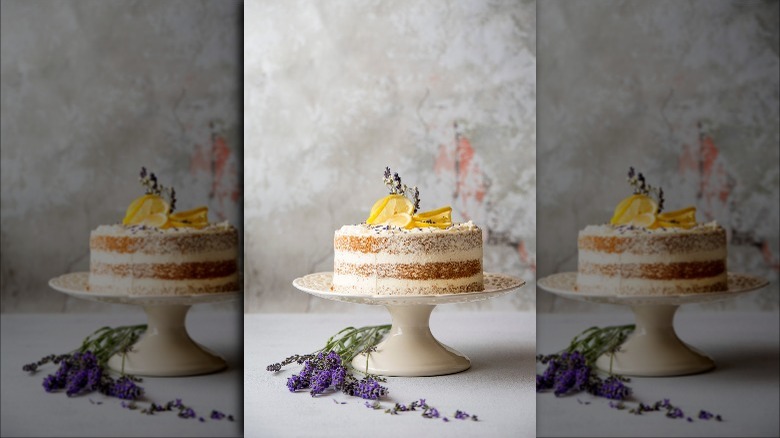 naked wedding cake on stand