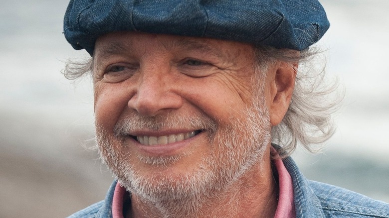 Francis Mallmann smiling while cooking