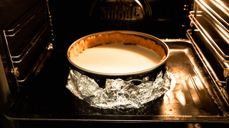 Cheesecake in water bath in oven