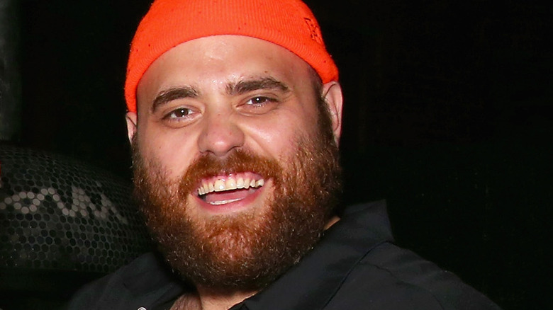 Christian Petroni with beard and orange hat