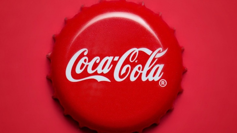 Coca-cola bottle cap on red background