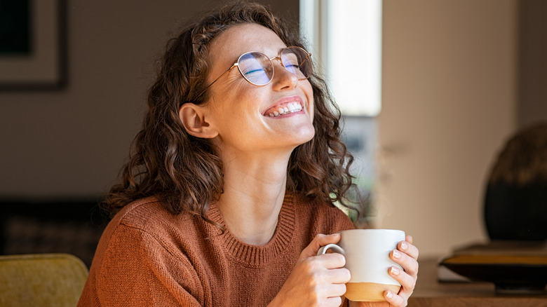 Happy person drinking coffee