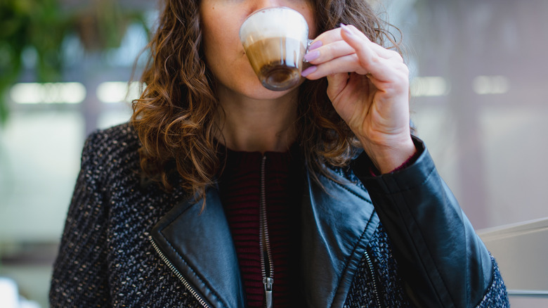 Person drinking small coffee
