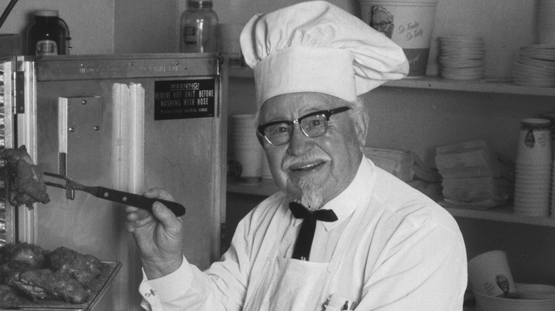 KFC founder Colonel Sanders cooking chicken