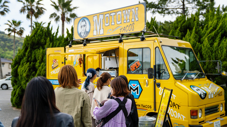 Customers in line at food truck