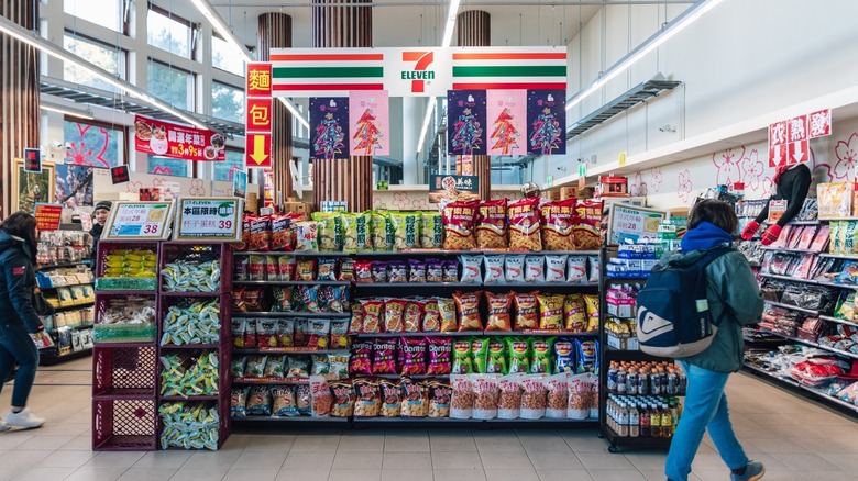 asian 7 eleven convenience store with shoppers