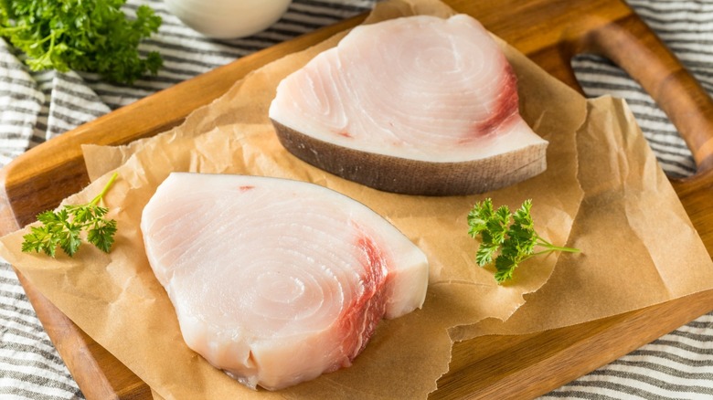 raw swordfish on cutting board