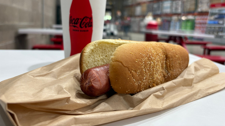 Costco hot dog combo on food court table.