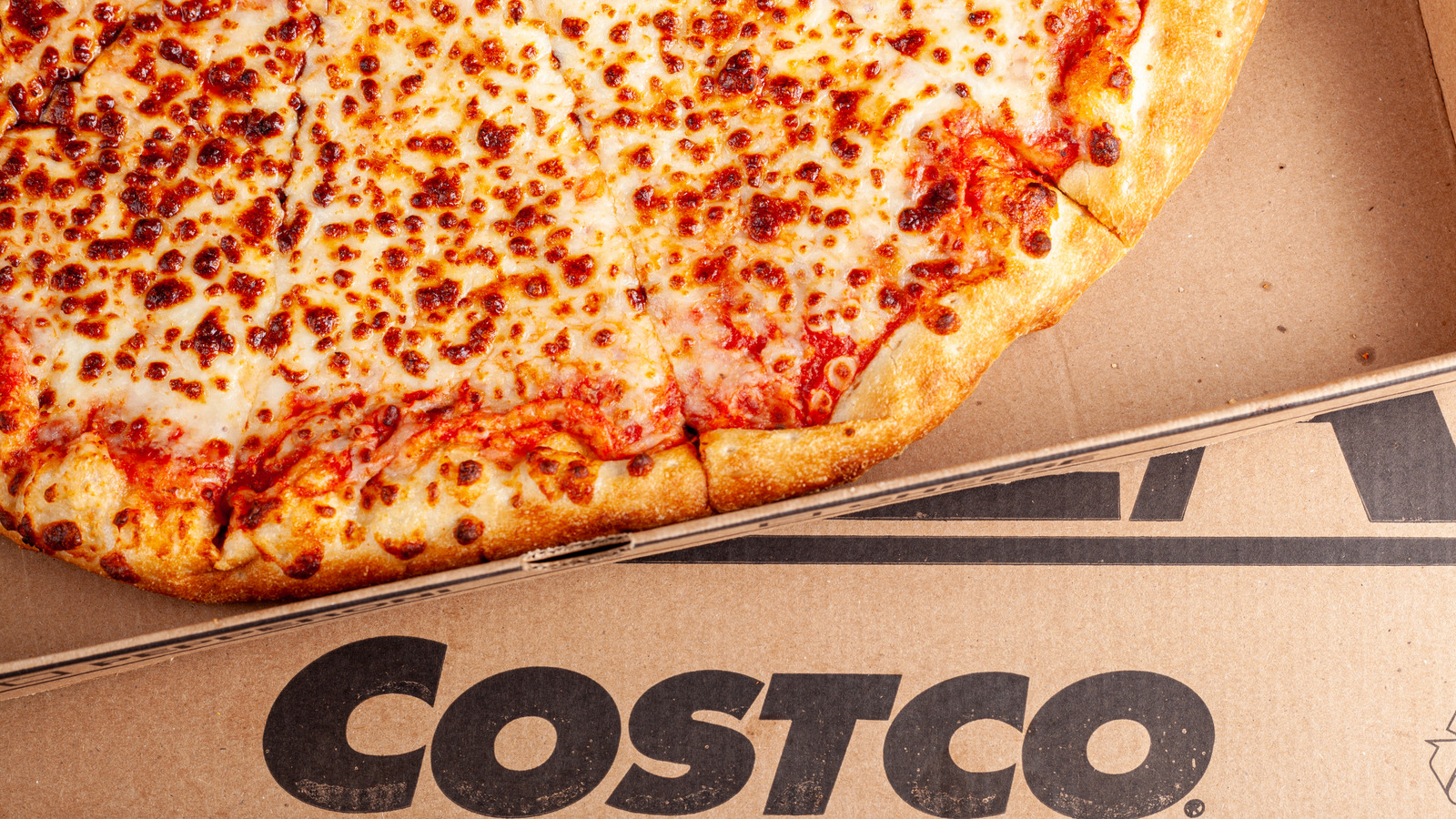 Why Costco's Food Court Pizza Tastes So Different From The Kirkland Frozen Version