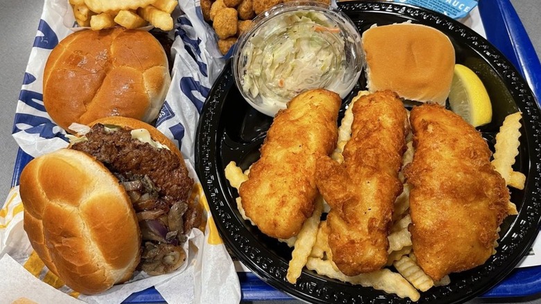 Burgers, fries, battered fish, and fried cheese curds from Culver's on a tray