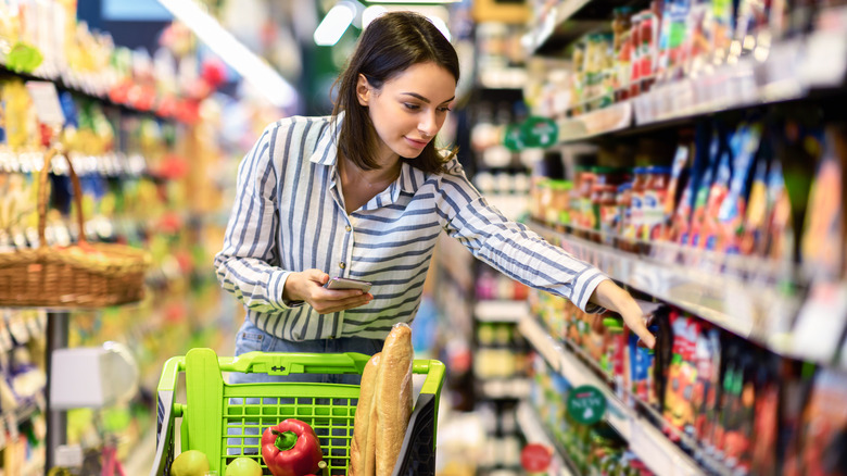 Person with green shopping cart