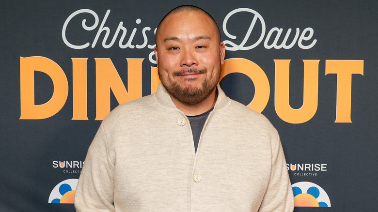 David Chang in beige sweater at event