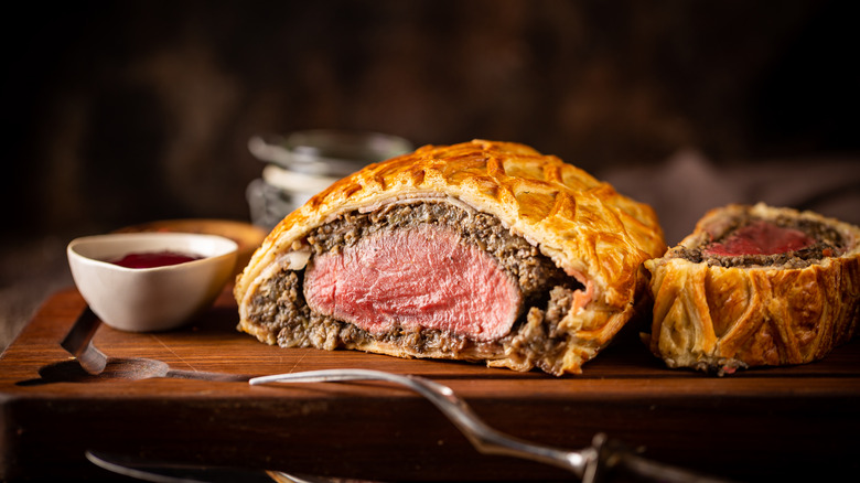 A sliced beef Wellington ready to serve