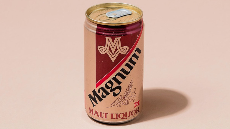 Vintage can of Magnum malt liquor against a beige background