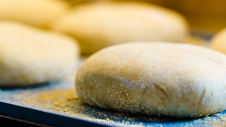 English muffins cooking on griddle