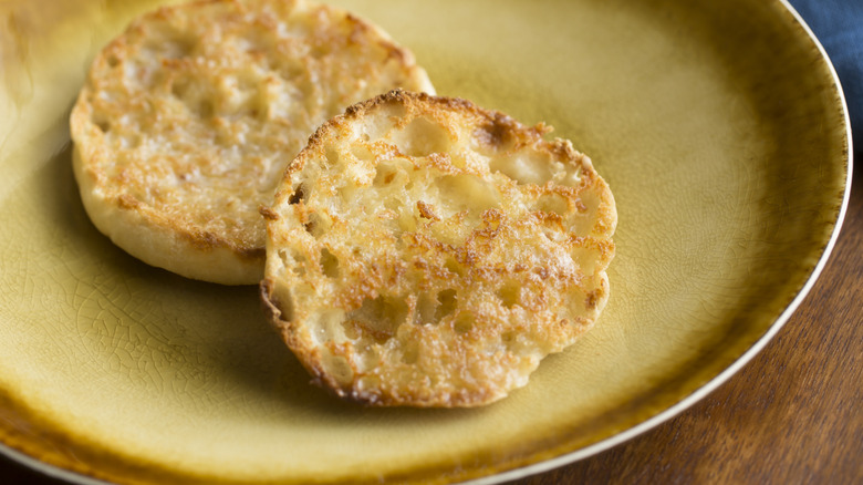Toasted split English muffin on plate