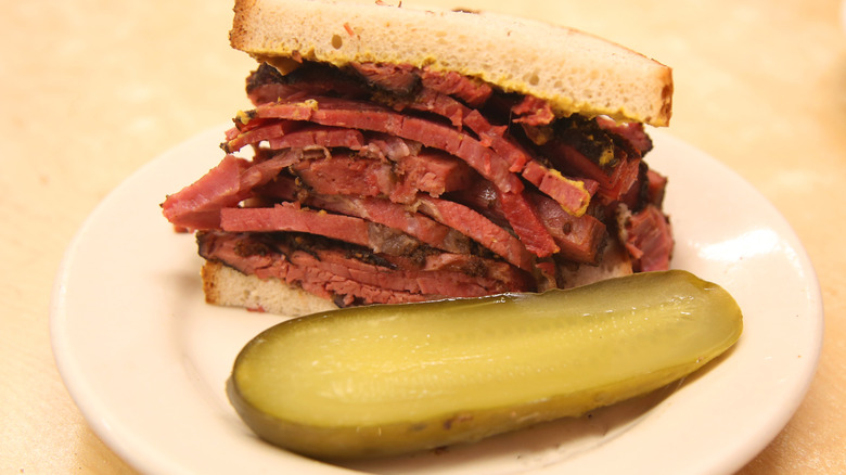 Pastrami sandwich with a pickle