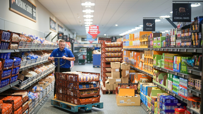 aldi employee stocking shelves