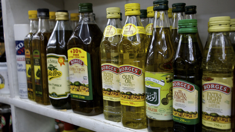 Olive oil packaged in various bottle sizes, shapes, and colors