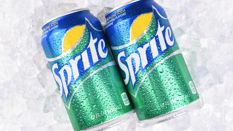 Two Sprite cans on ice