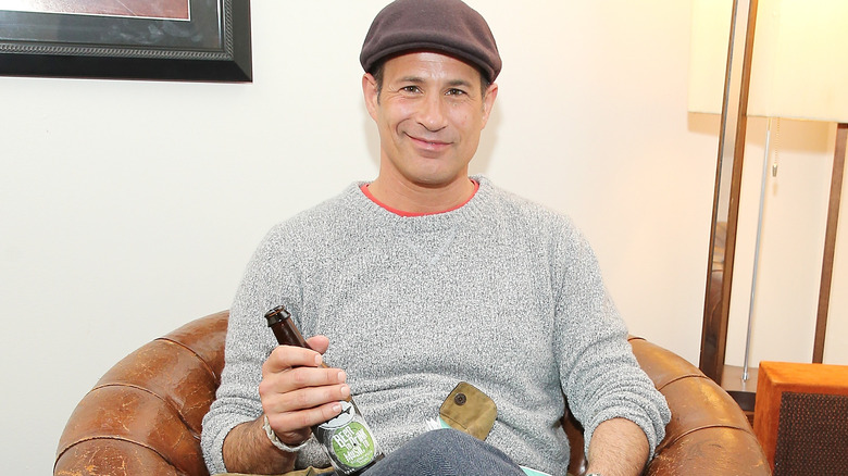 Sam Calagione holding beer bottle