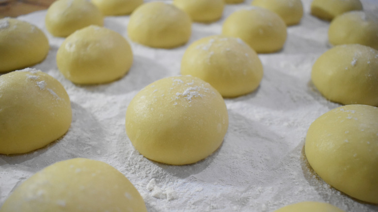 Raw donut balls proofing
