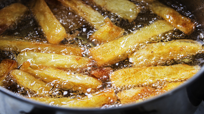 Frying potatoes strips in oil