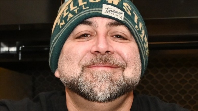 Close-up of Duff Goldman wearing a green Landmark Project beanie