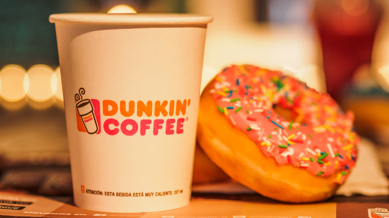 Dunkin' coffe with frosted sprinkle donut