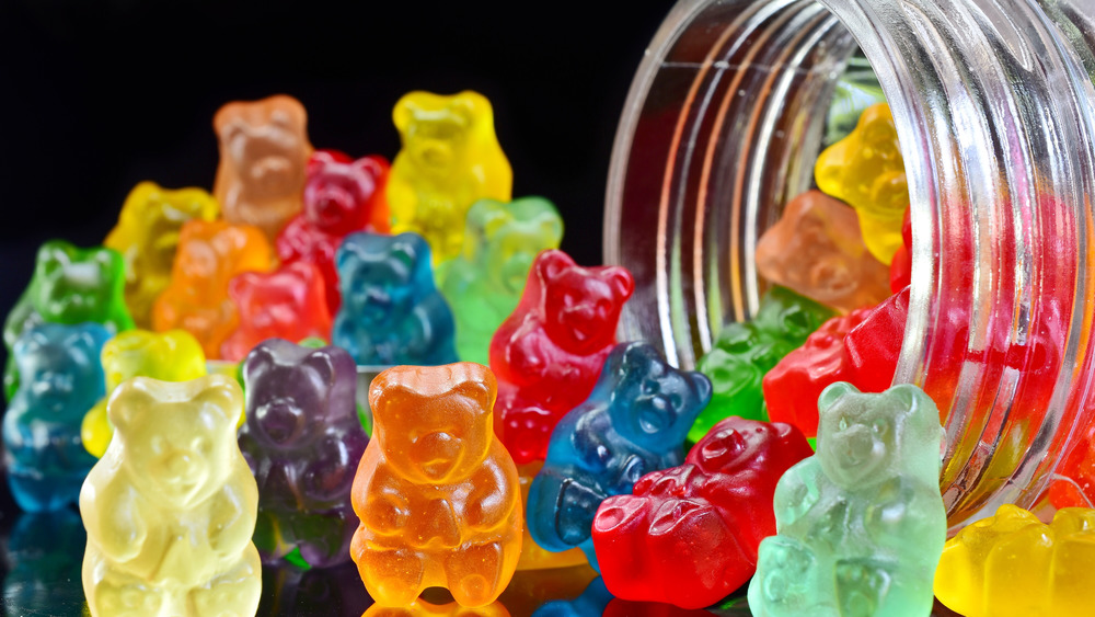 Gummy bears spilled out of a mason jar