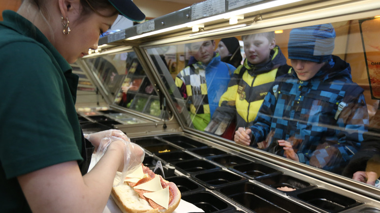 Subway worker making sandwich