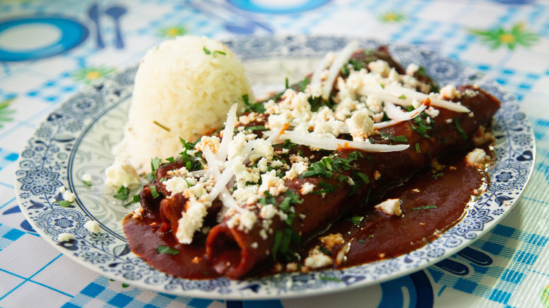 enchiladas topped with Mexican cheese