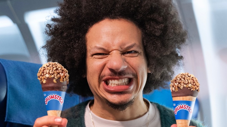 Eric André holding drumstick desserts