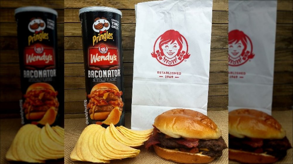 A can of Pringles Wendy's Baconator flavor with a Wendy's bag and Baconator