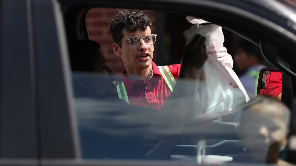 car in Chick-fil-A drive-thru with a child