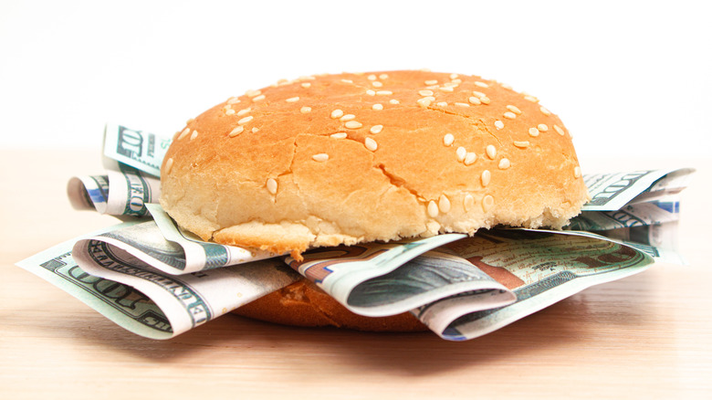Burger with dollar bills