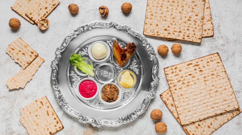 Passover seder plate surrounded by matzo boards