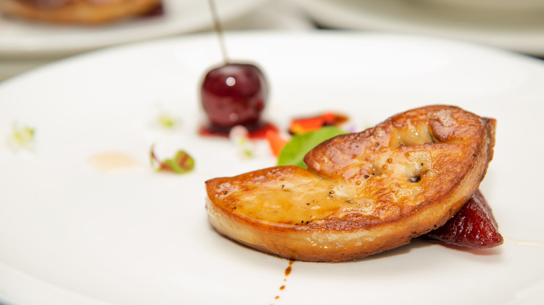 foie gras with cherries on a plate