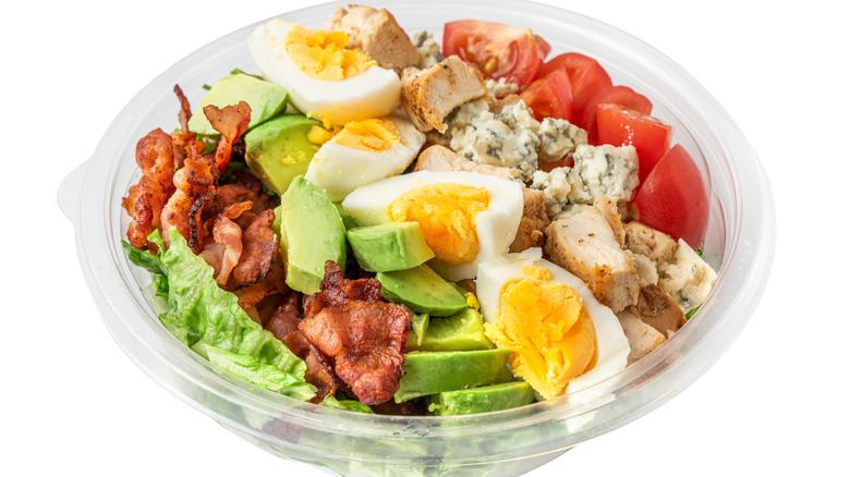 retail cobb salad in plastic bowl