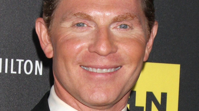 Close up of Bobby Flay smiling on the red carpet