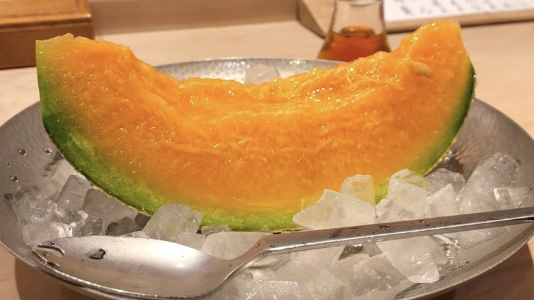 Yubari melon slice on ice with spoon