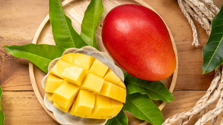 Egg of the sun mango in wooden dish