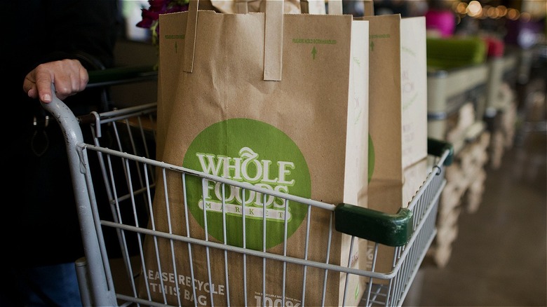 whole foods paper bag in a shopping cart