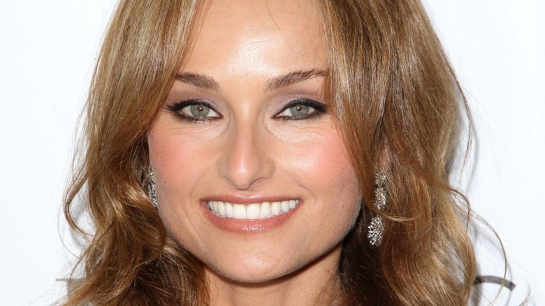 Giada De Laurentiis smiling on white background