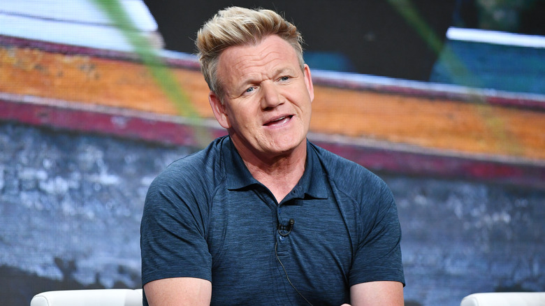 Gordon Ramsay sitting and talking in polo shirt