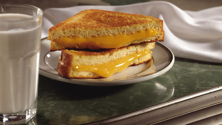 grilled cheese and milk on diner counter